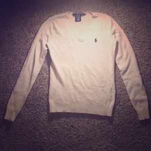 A polo v-neck sweater